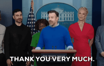 a gif of jason sudeikis as ted lasso saying thank you very much at a press conference