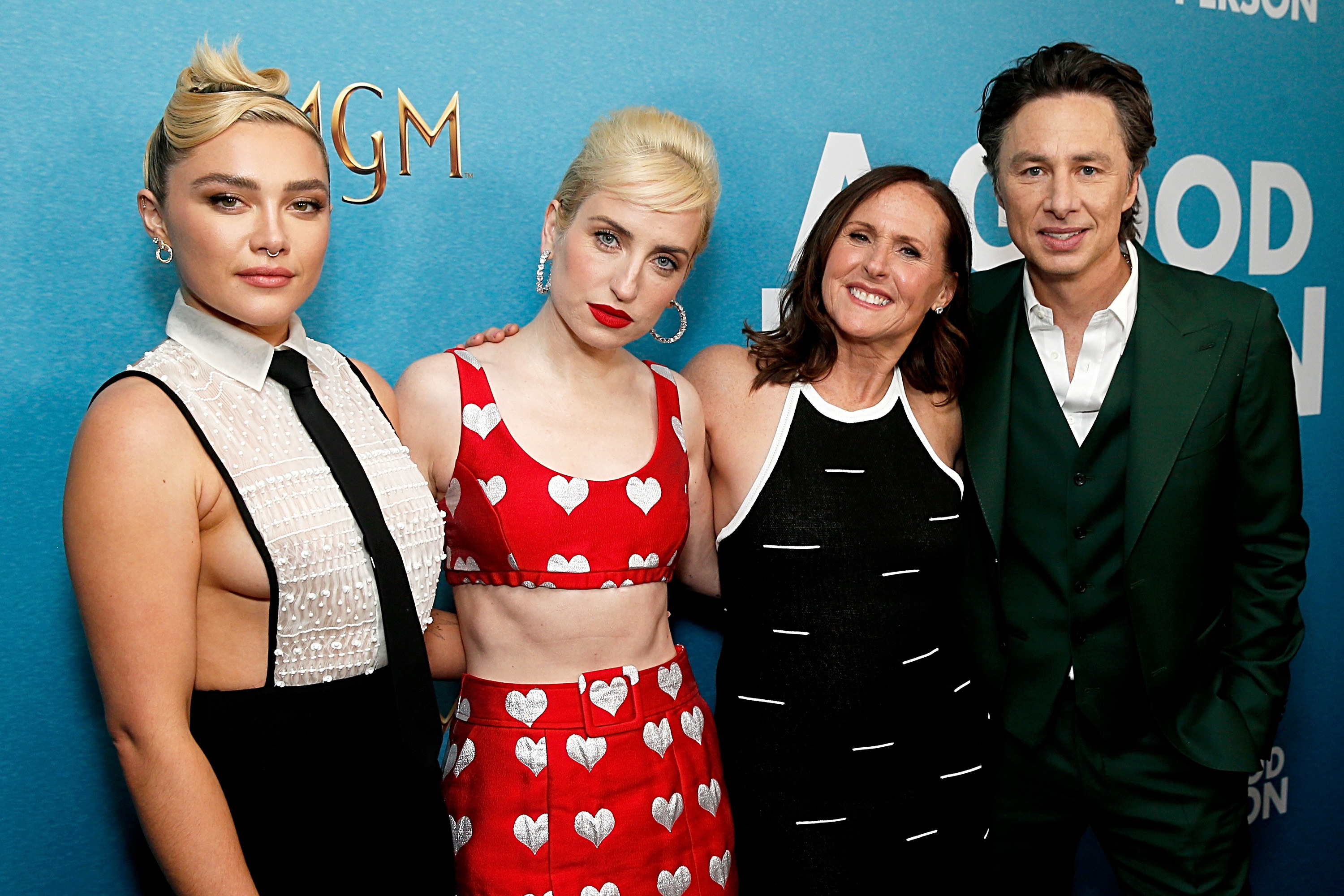 From left to right: Florence, Zoe Lister-Jones, Molly Shannon, and Zach Braff smile for a group photo on the red carpet