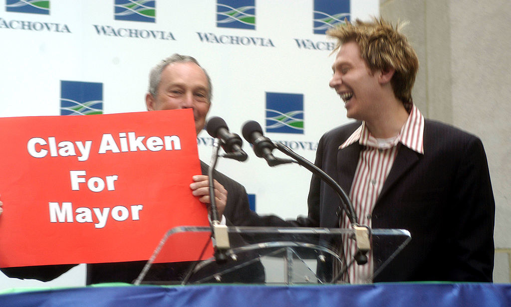 Michael is holding up a &quot;Clay Aiken for Mayor&quot; sign as Clay smiles