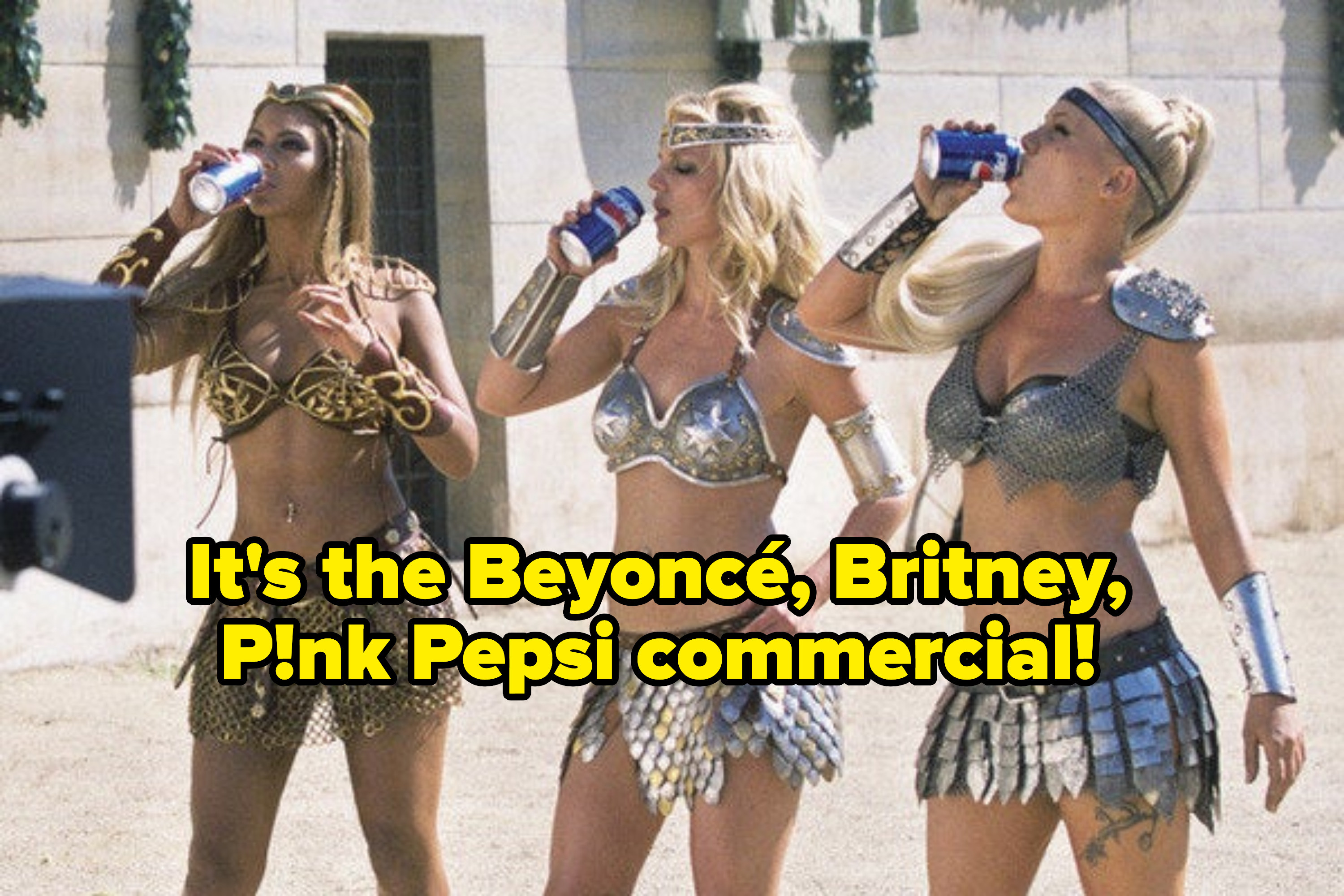 From left to right: Beyoncé, Britney, and Pink dressed as gladiators sipping on cans of Pepsi for the soda&#x27;s commercial
