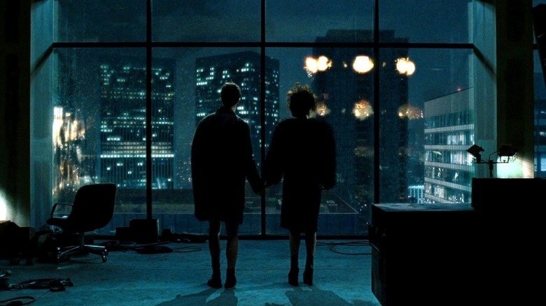 Edward Norton as The Narrator and Helena Bonham Carter as Marla hold hands and watch fireworks out a window at the end of &#x27;Fight Club&#x27;