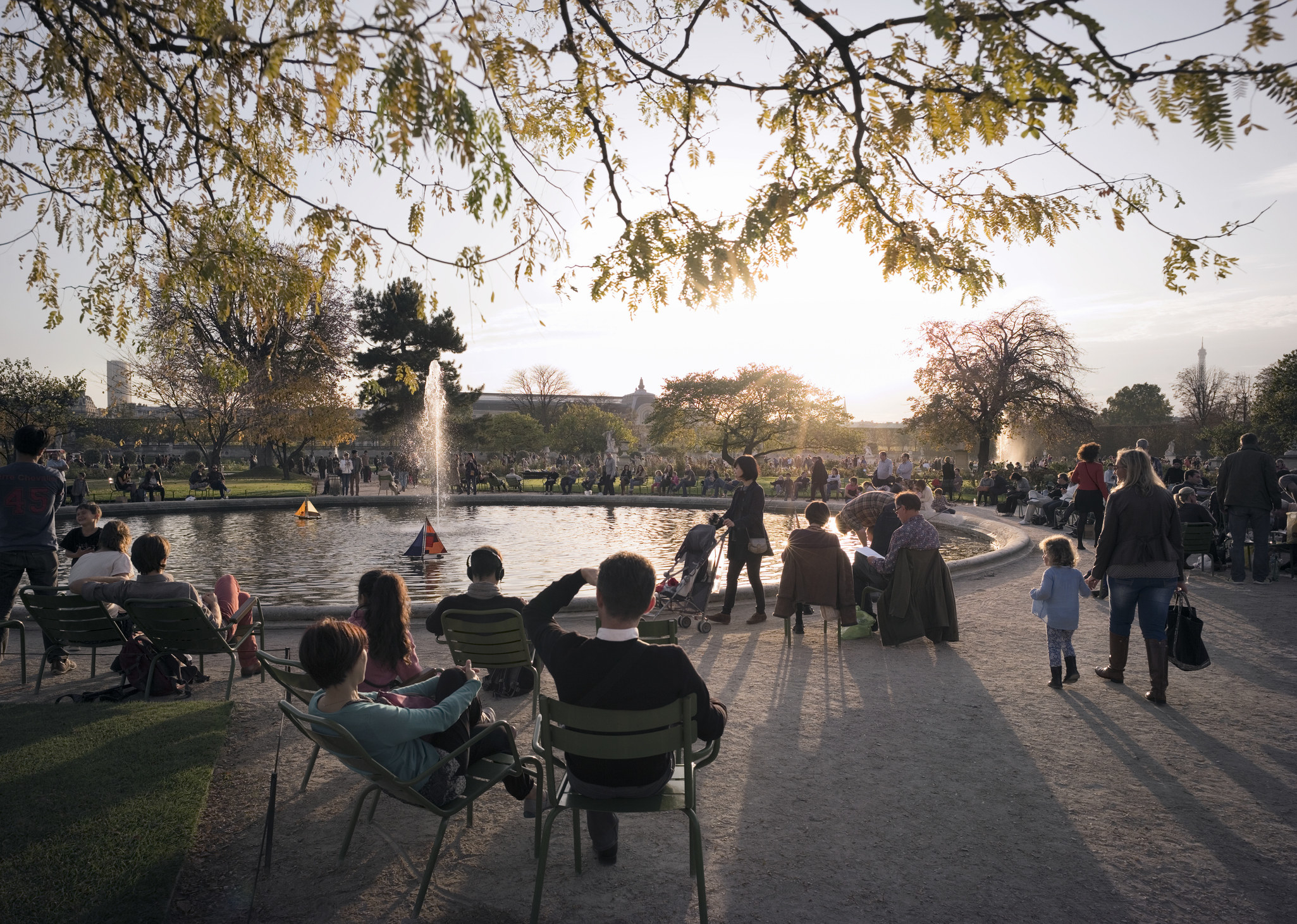 People sitting in a garden in Paris.