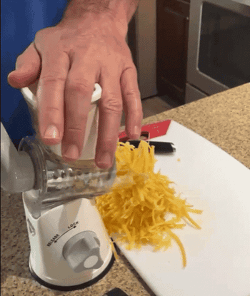 Reviewer shows how easy it is to grate cheese