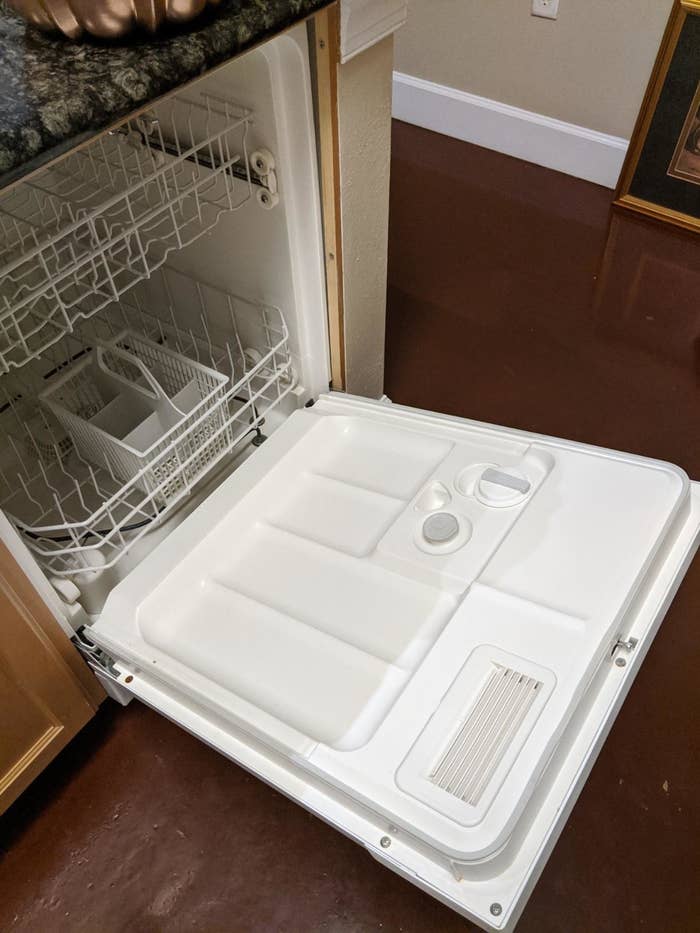 Reviewer image of clean white dishwasher interior that used to be dirty and yellow