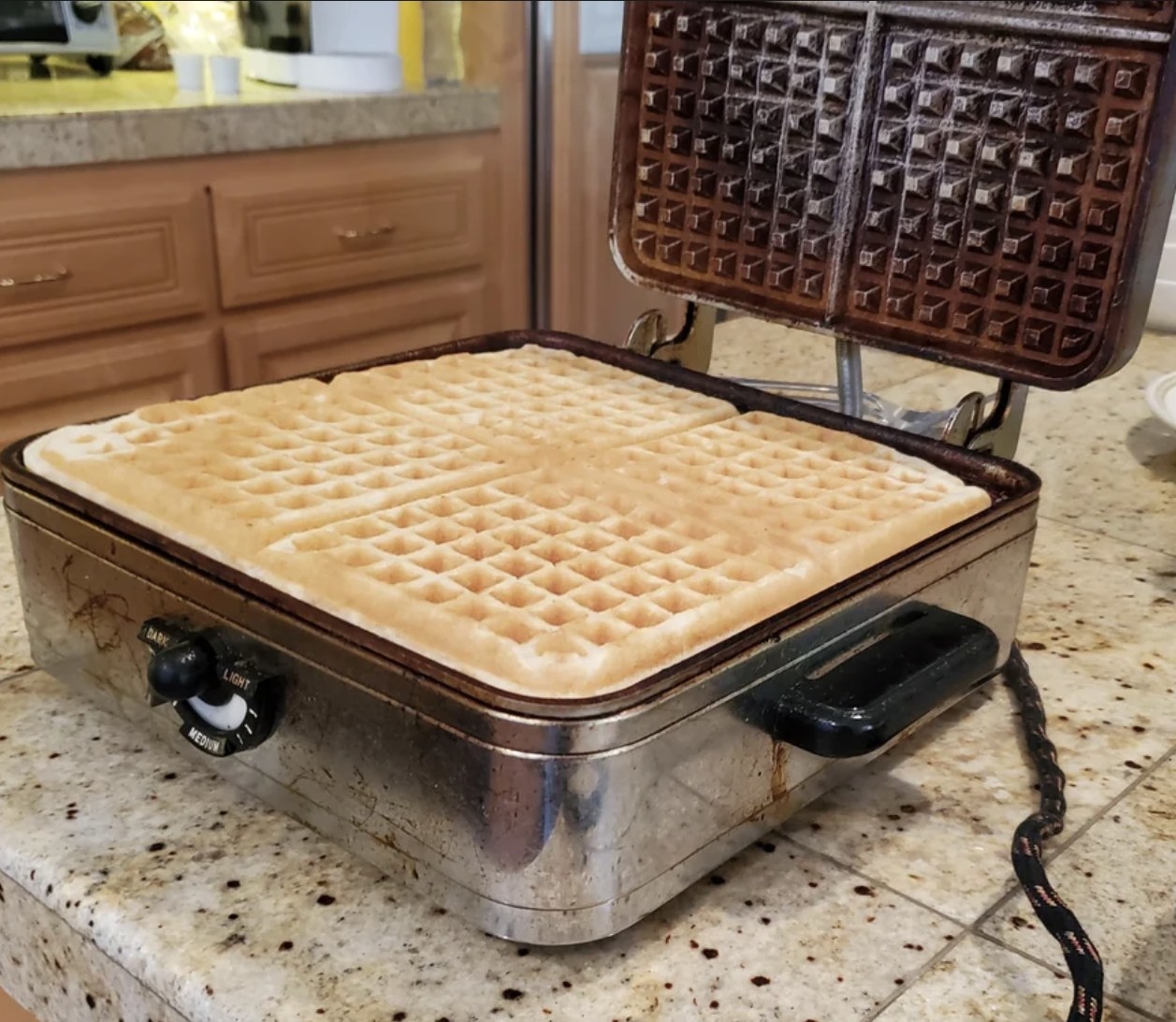 old waffle maker with made waffles
