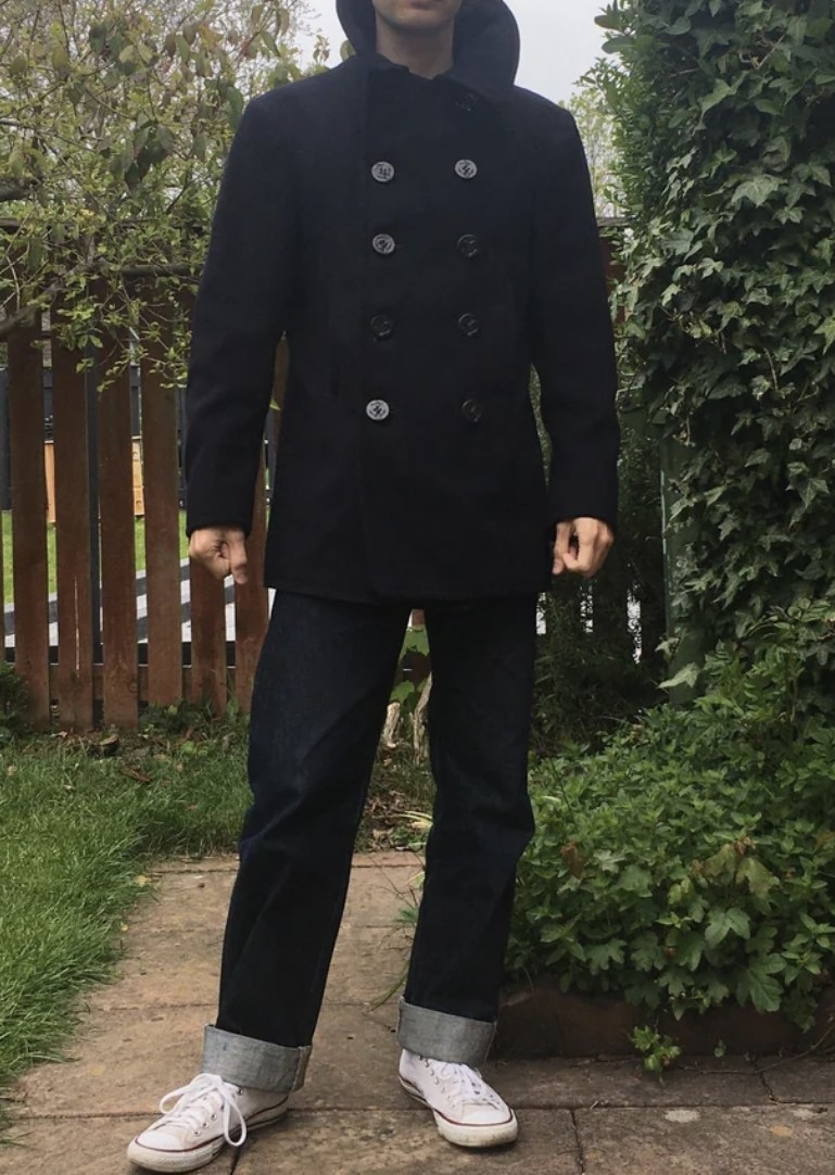 person wearing a peacoat