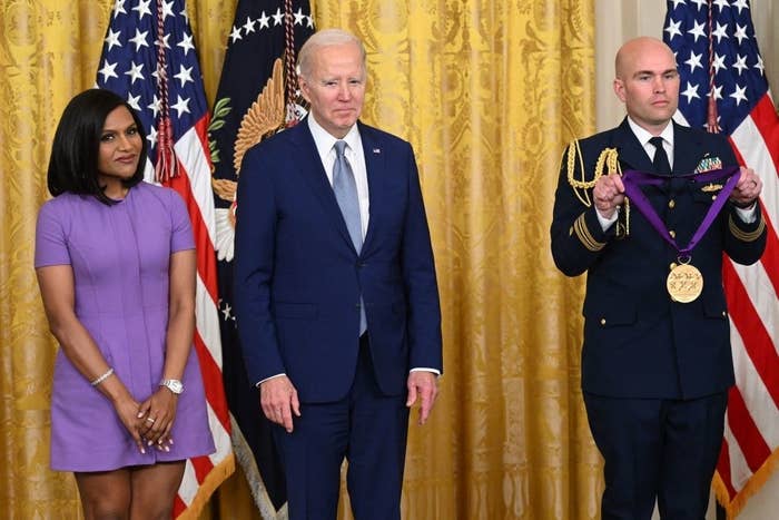 From left to right: Mindy, President Biden and a military official holding Mindy&#x27;s medal