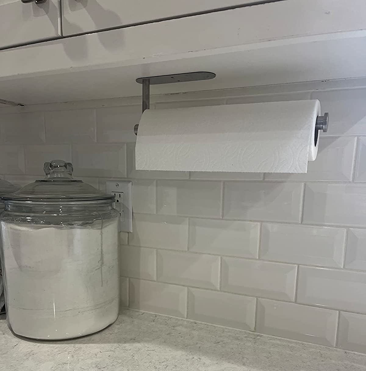Reviewer image of paper towel holder mounted to the bottom of their kitchen cabinet