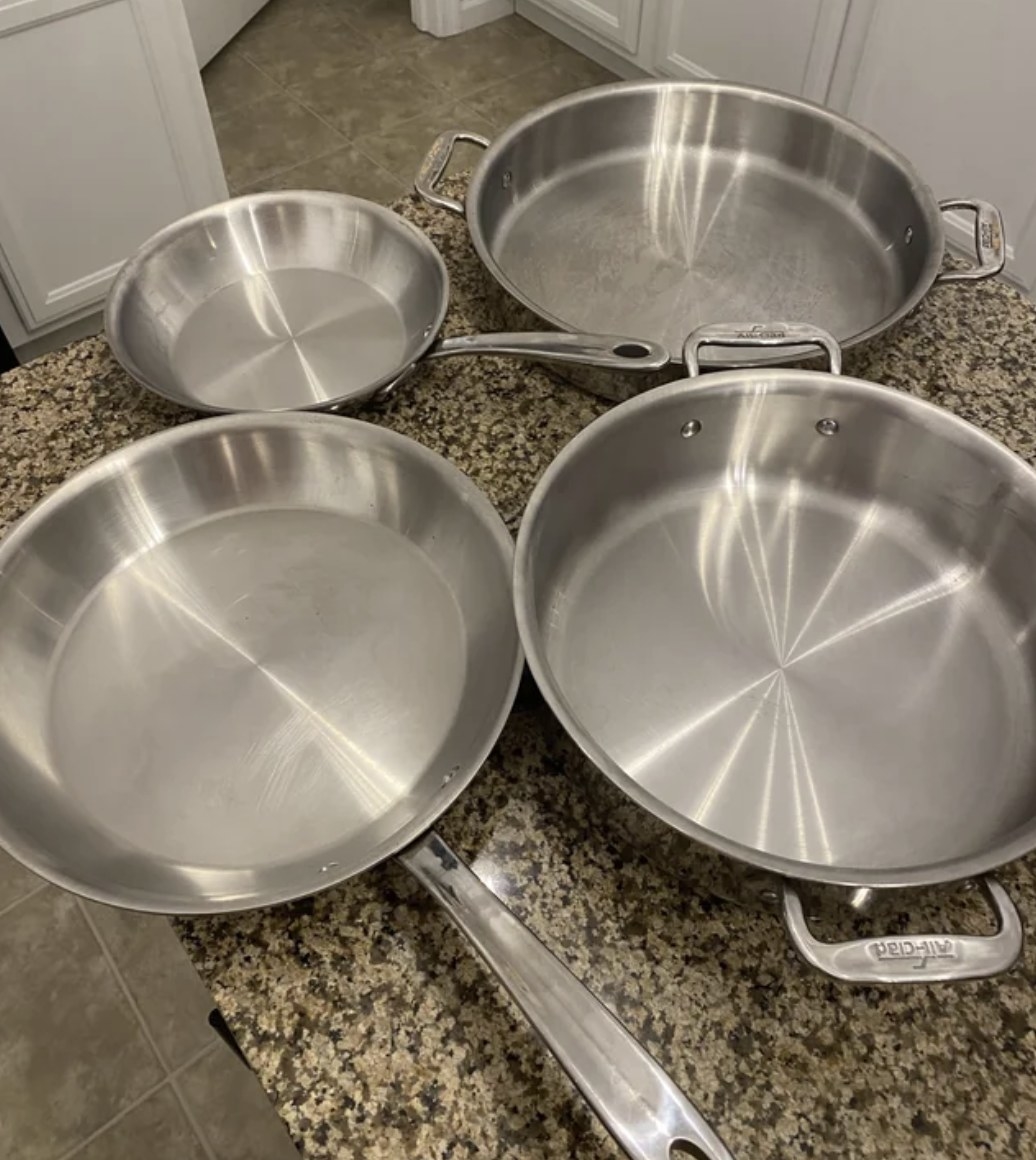 four pans on a countertop