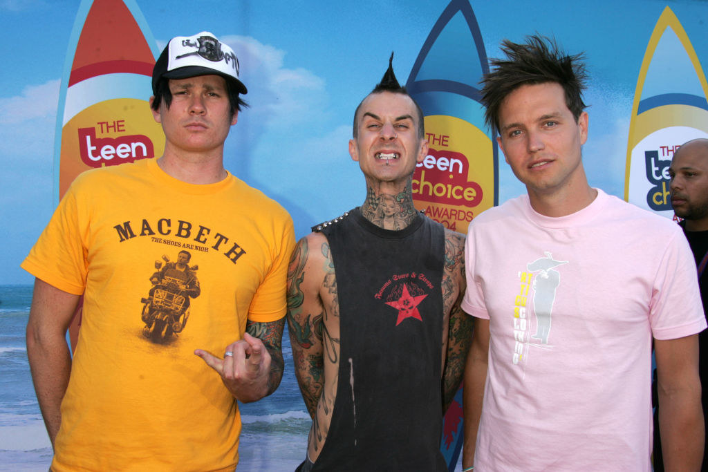 blink 182 members with spiky hair, a tall mohawk, and a hat