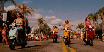 The girls riding around on mopeds in Spring Breakers