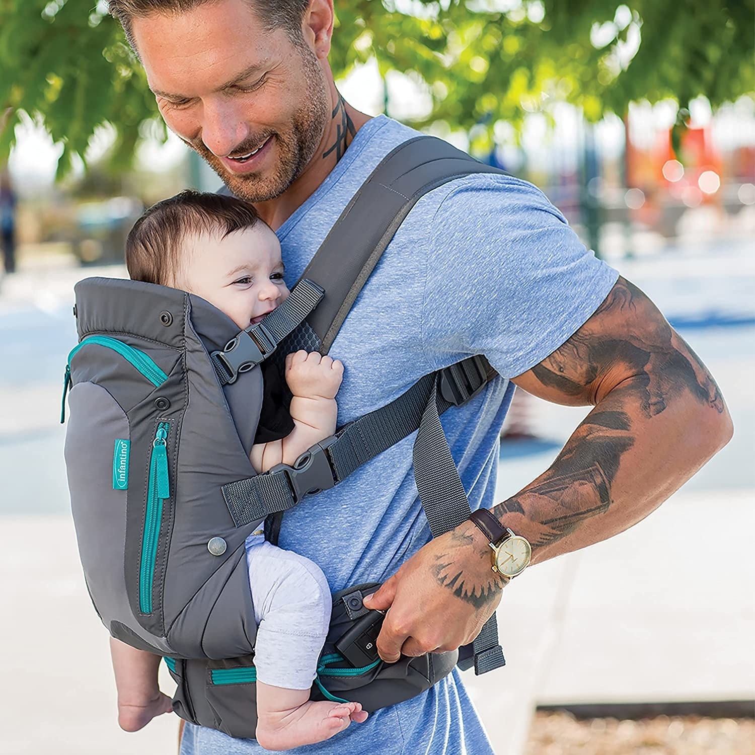 Man carrying baby in carrier