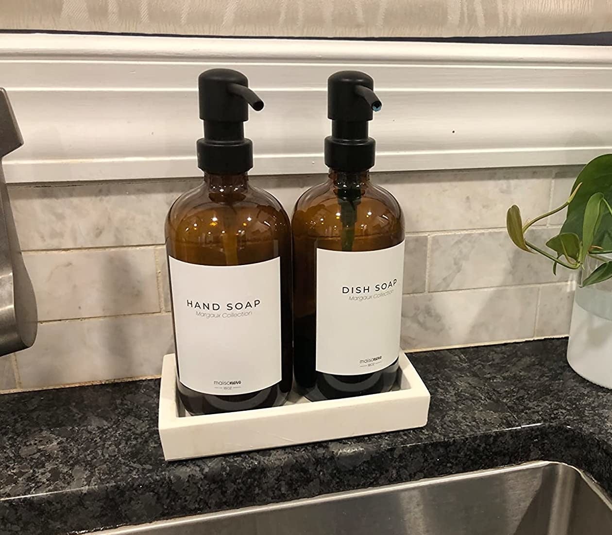 Reviewer&#x27;s hand soap and dish soap containers are shown