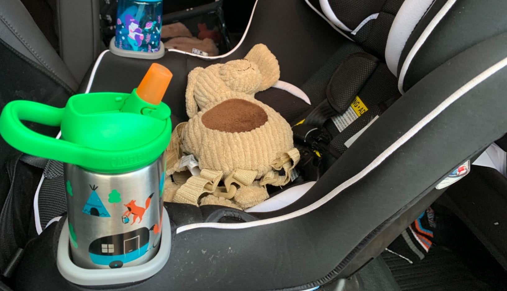 Water bottle in car seat cup holder