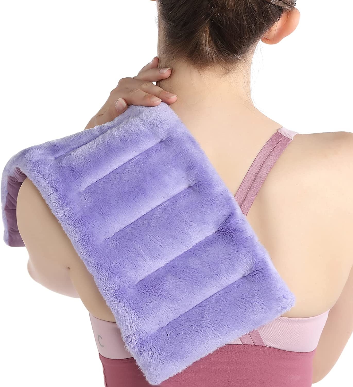 A person with the microwavable heating pad on their shoulder