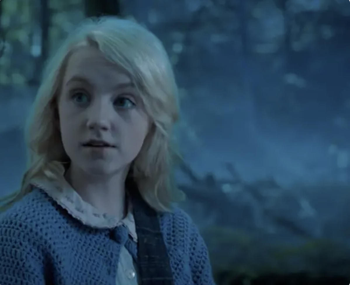 Close-up of Evanna as Luna looking to the side, not smiling