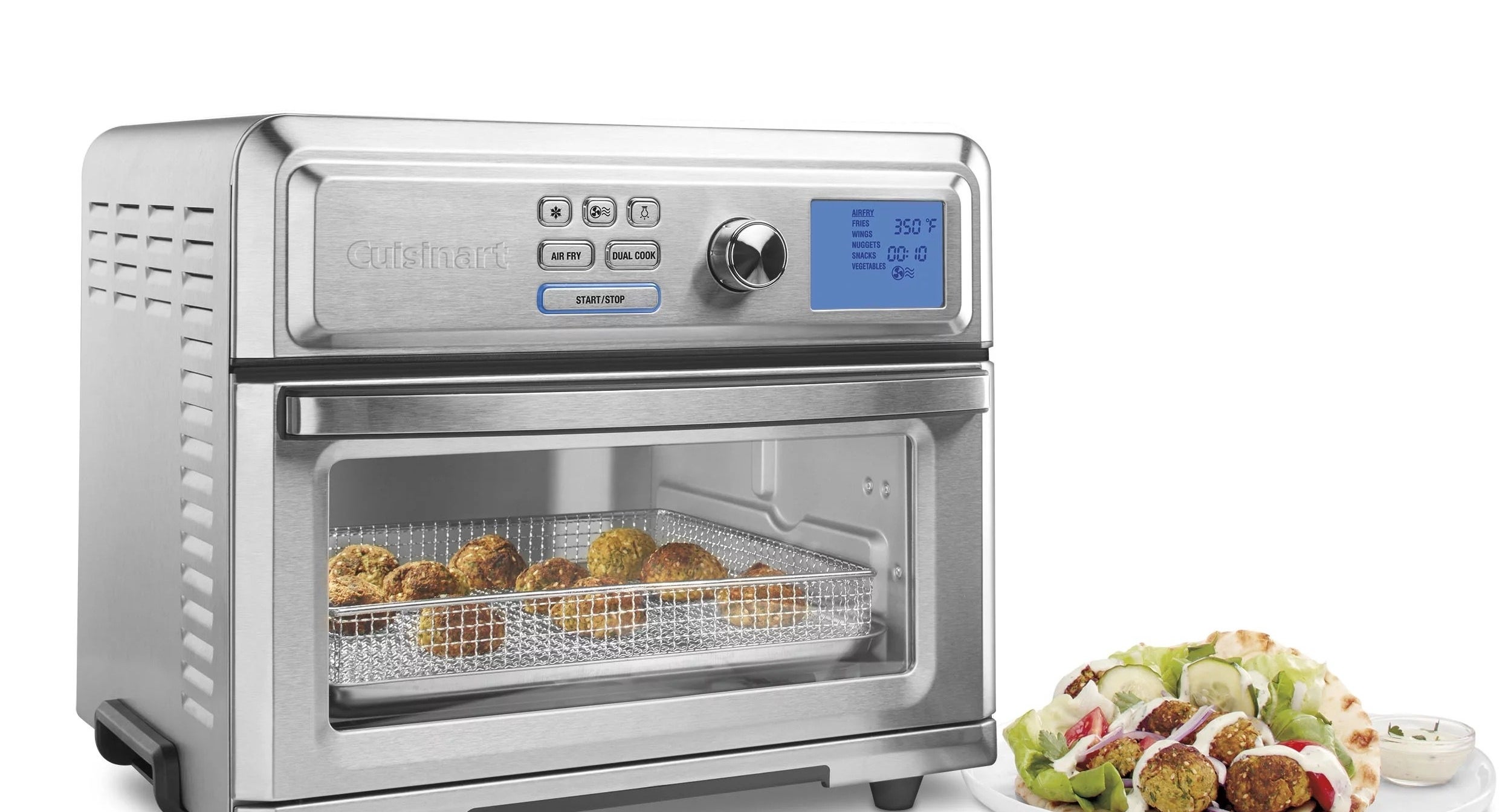 a silver air fryer/toaster oven cooking falafels