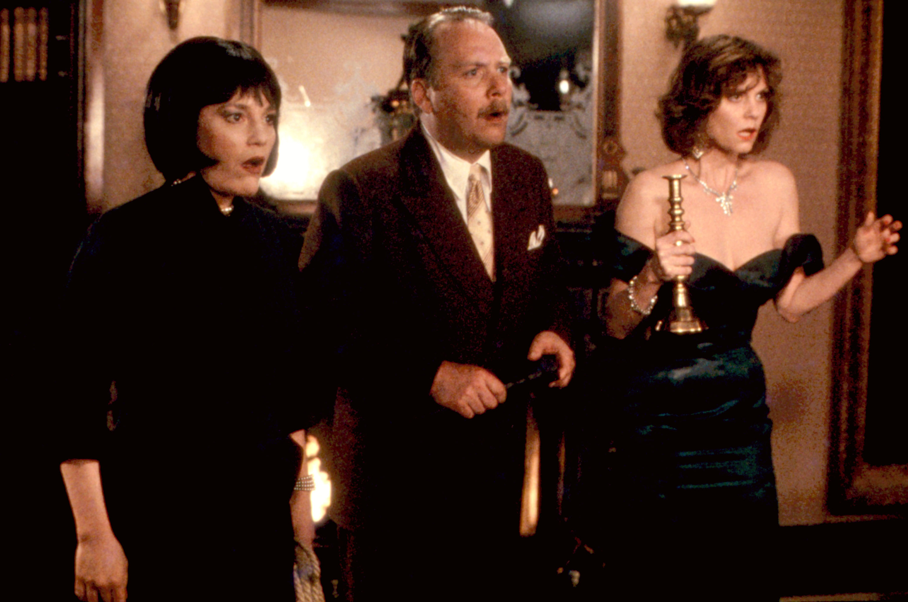 Madeline Kahn, Martin Mull, and Lesley Ann Warren stand in a room