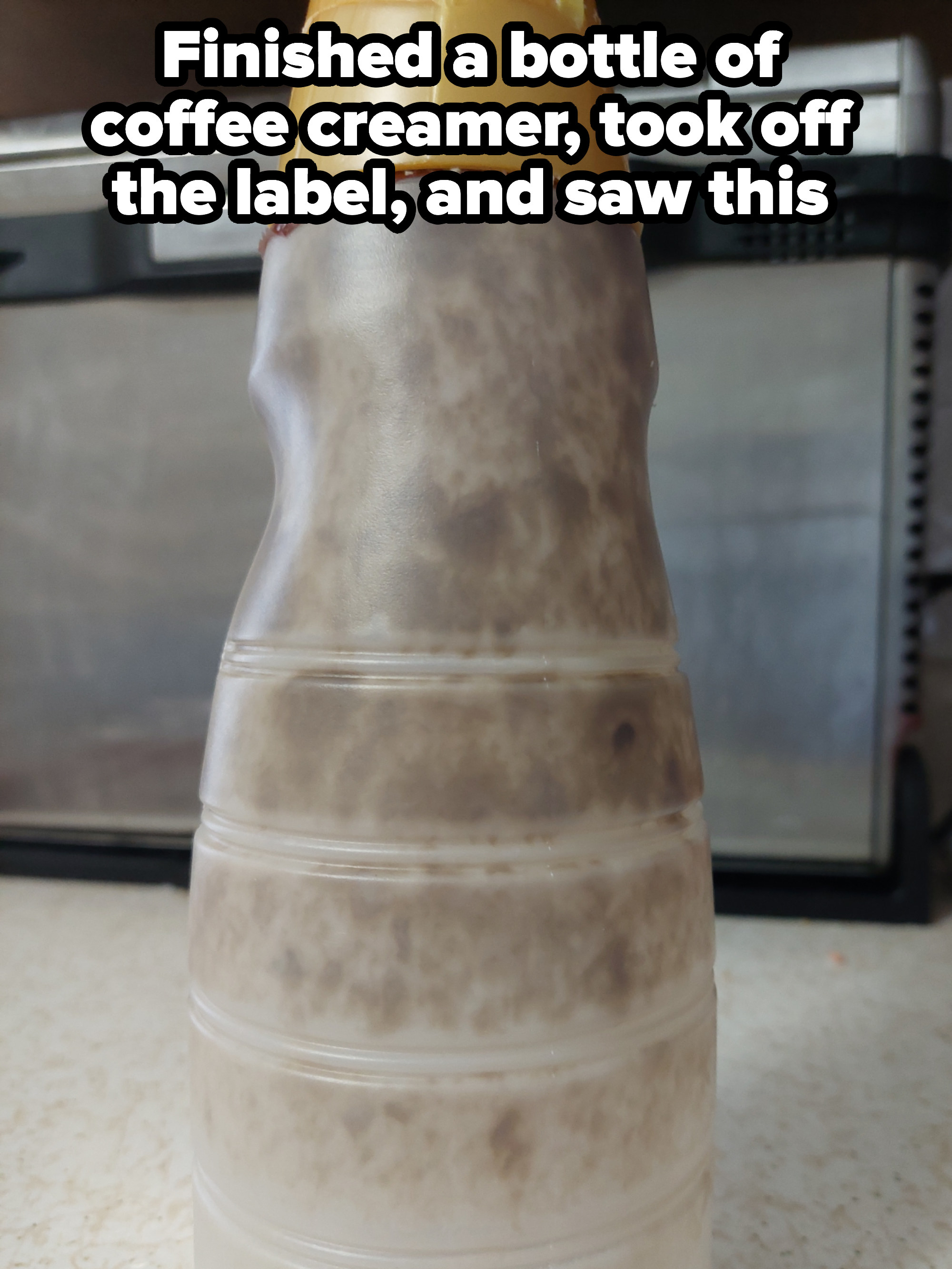 A moldy bottle of coffee creamer