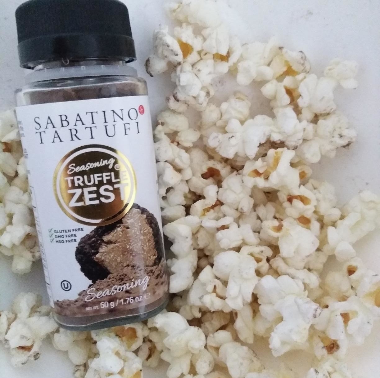 Reviewer image of bottle of seasoning and popcorn