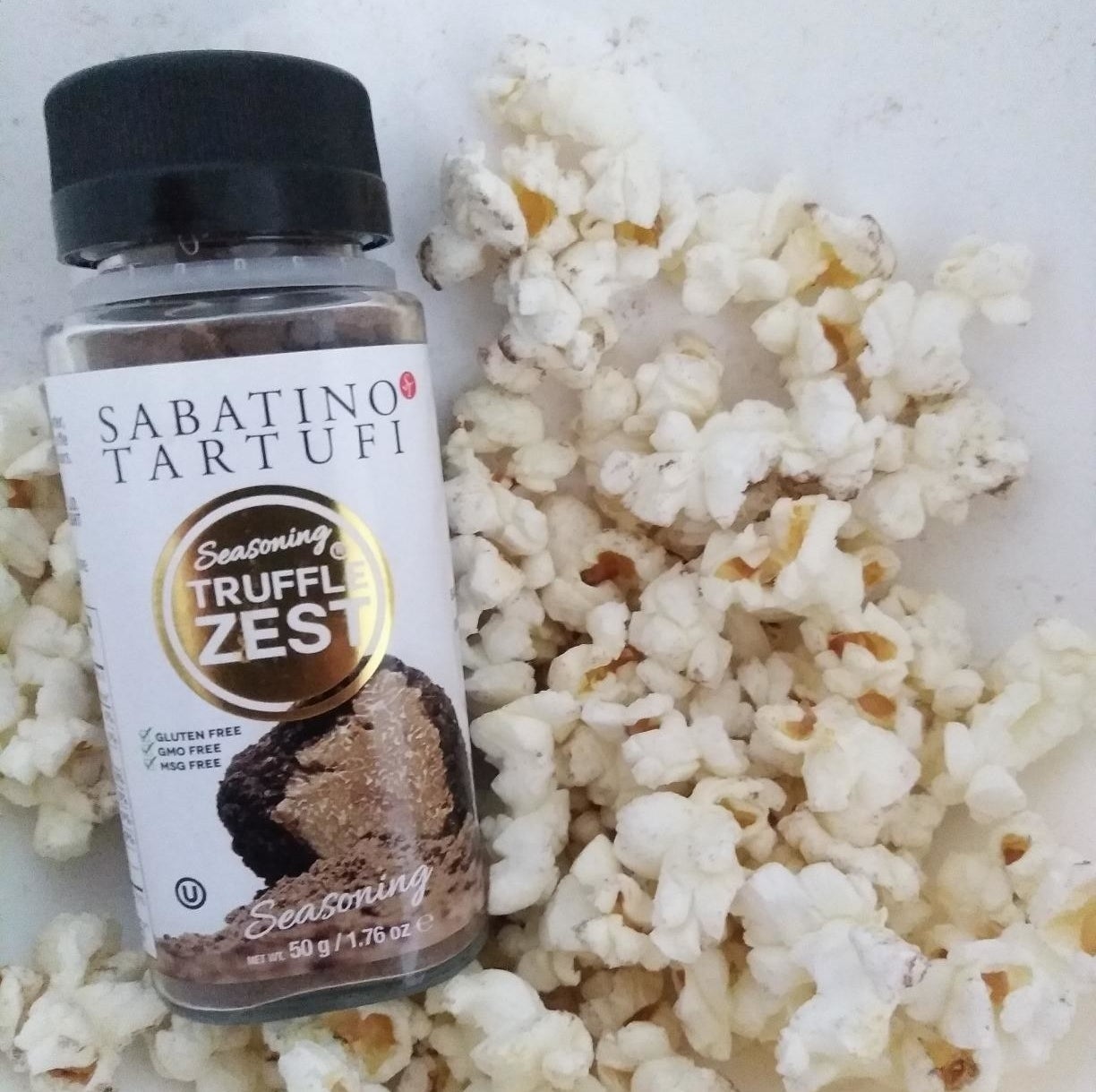 Reviewer image of bottle of seasoning and popcorn