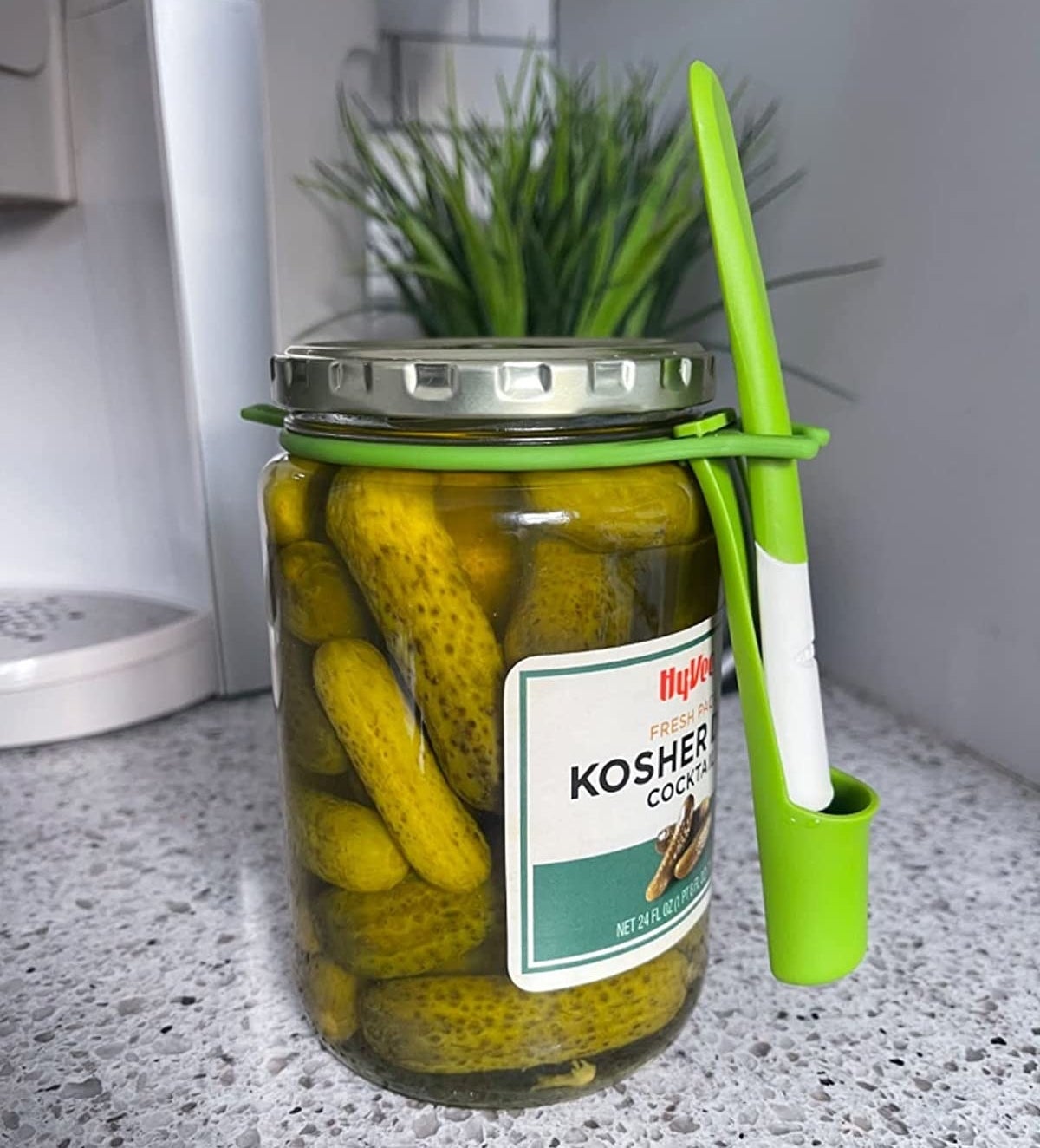 Reviewer image of fork attached to a jar of pickles