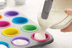 a model pouring batter into the muffin tins