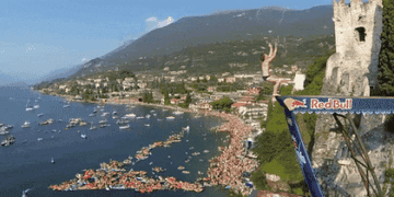 A person diving beautifully off a cliff