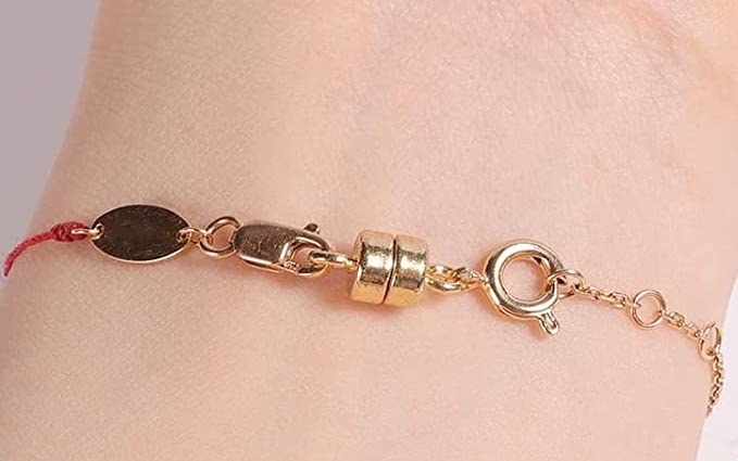person with the bracelet on using the magnetic clasp