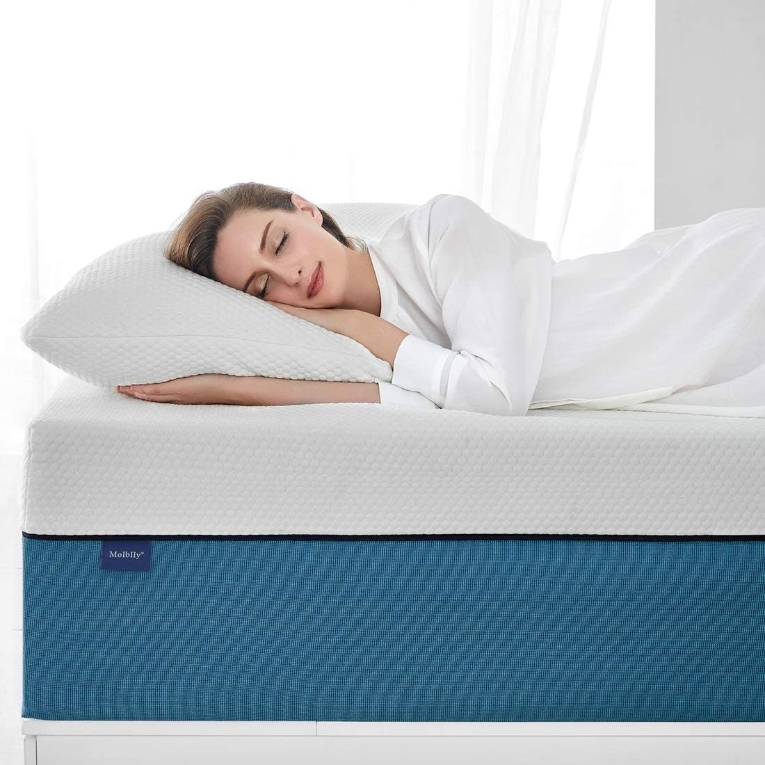 a person laying on the mattress
