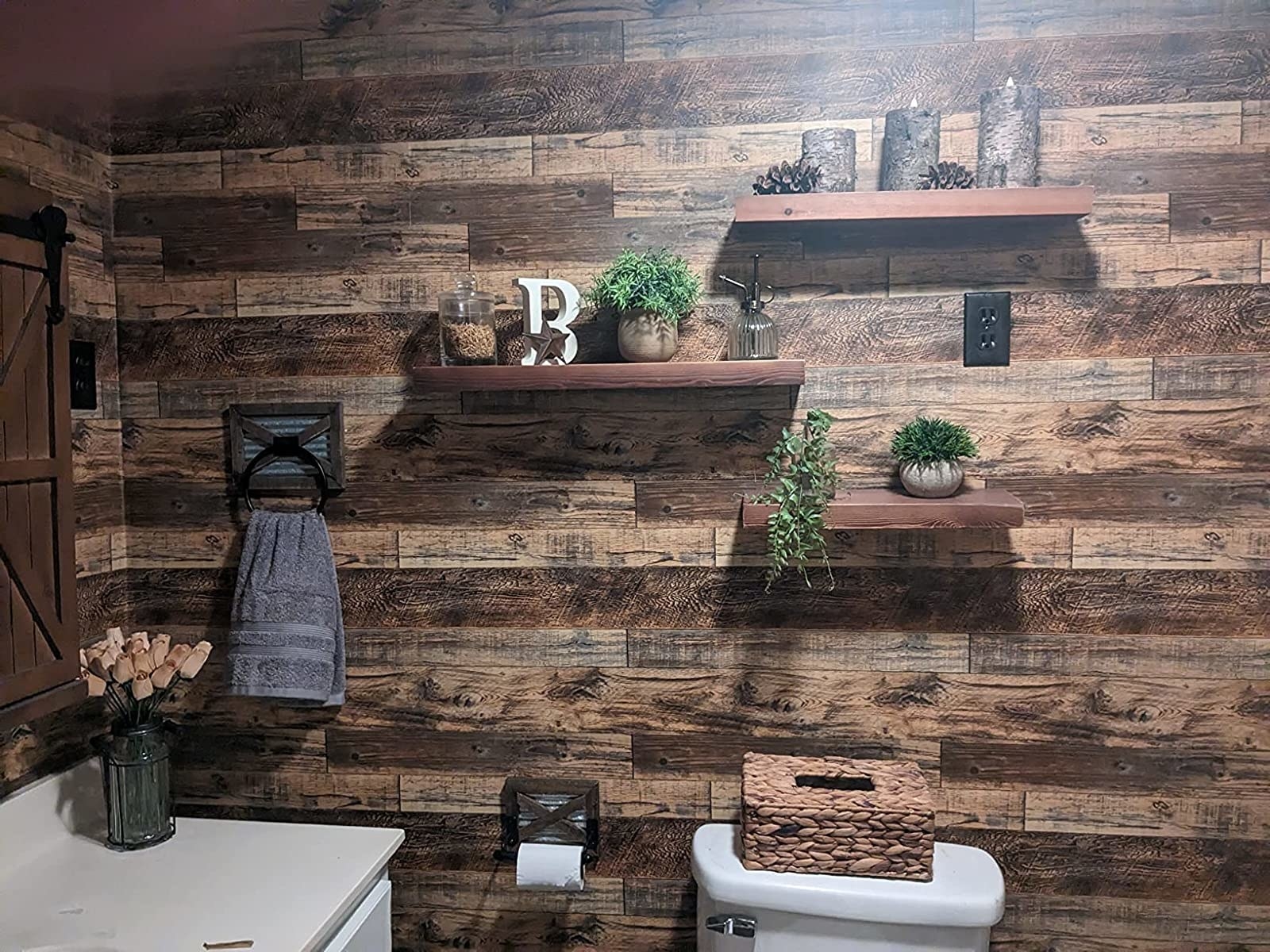 Reviewer image of the wallpaper installed in their bathroom