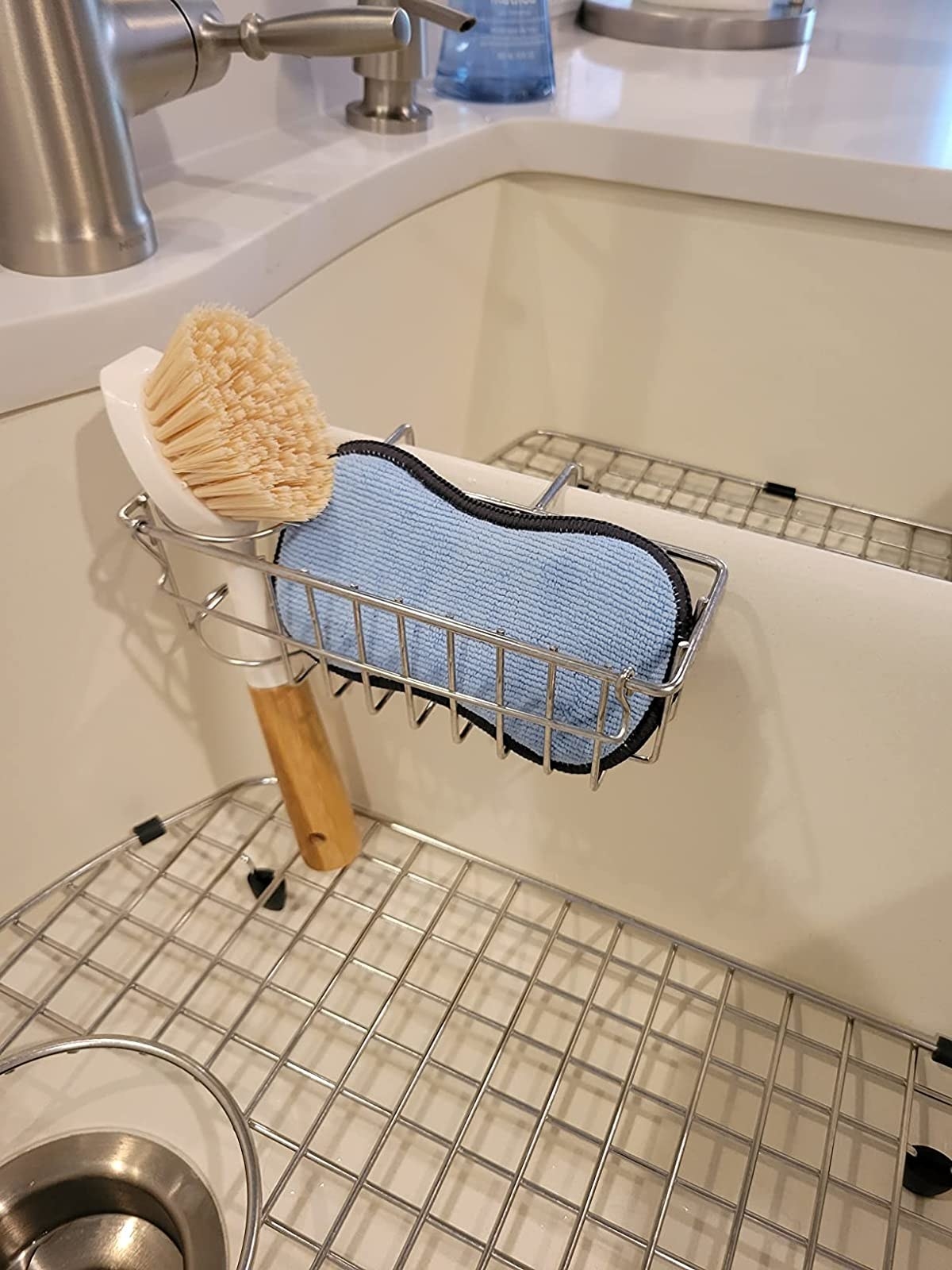 Reviewer image of a sponge and brush in holder over their sink