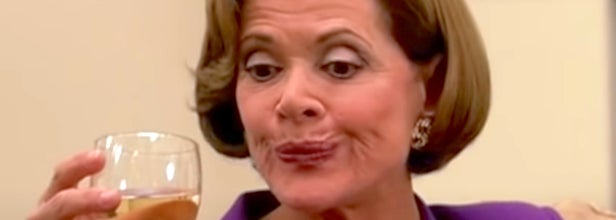 lucille bluth on arrested development holding a glass of wine