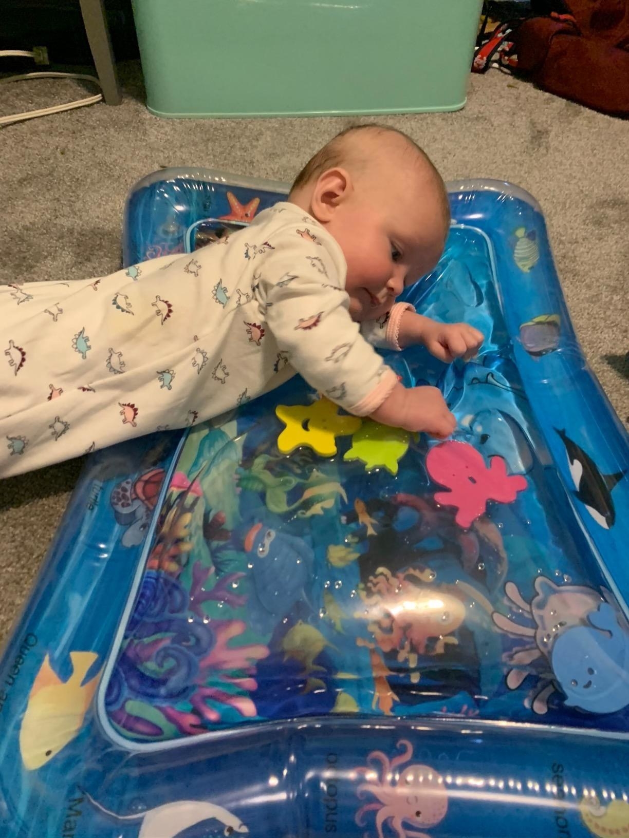 Baby playing on mat