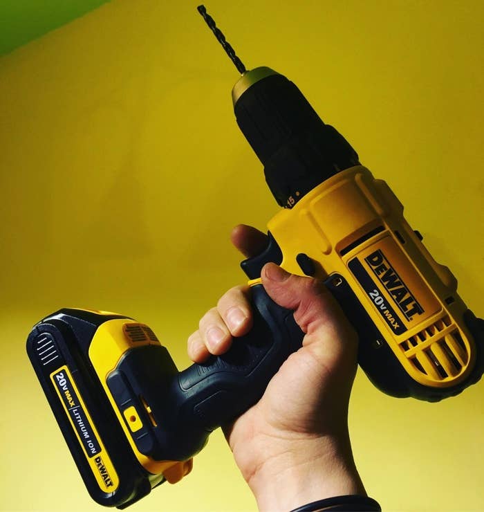Reviewer holding the yellow compact drill up
