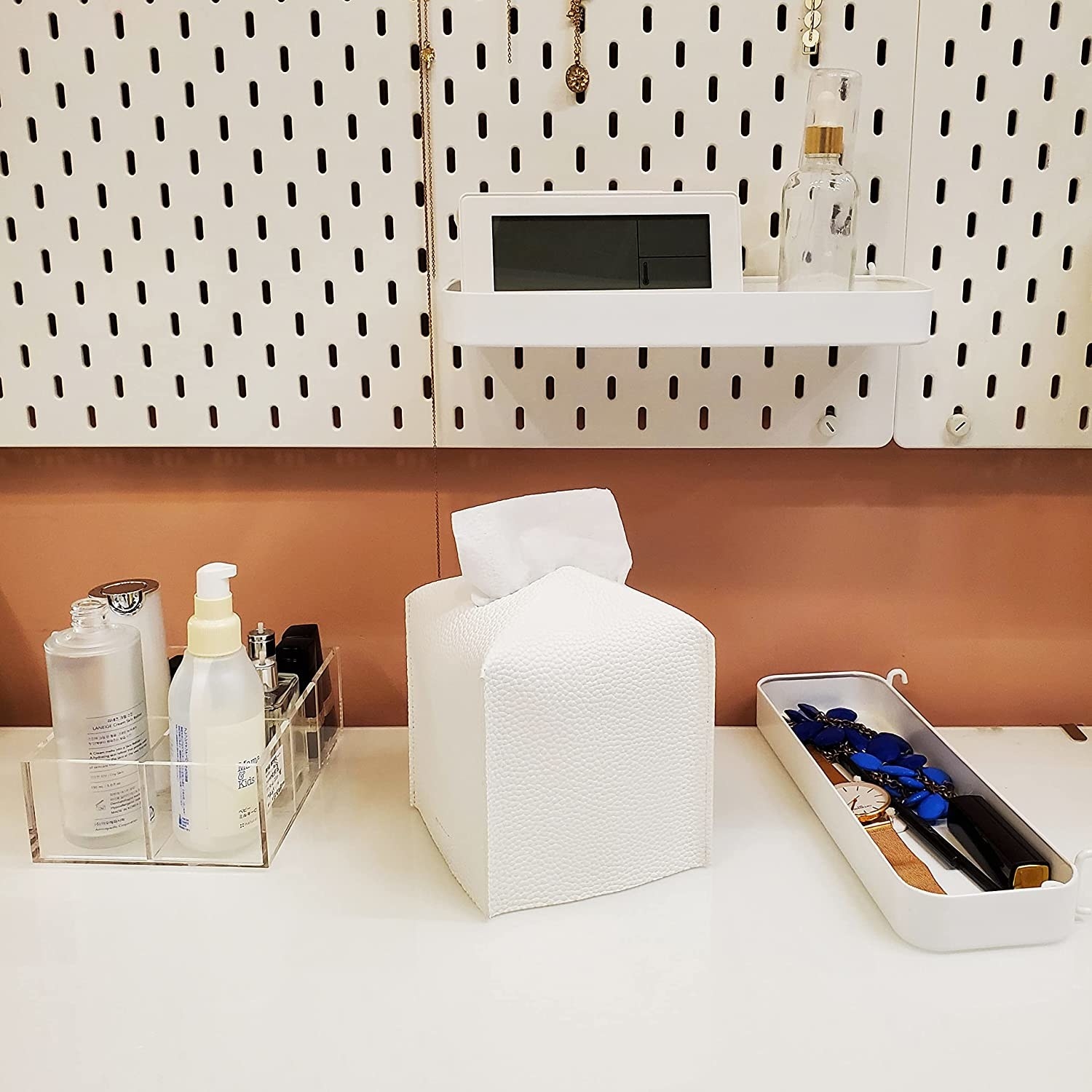 The white tissue box holder is shown