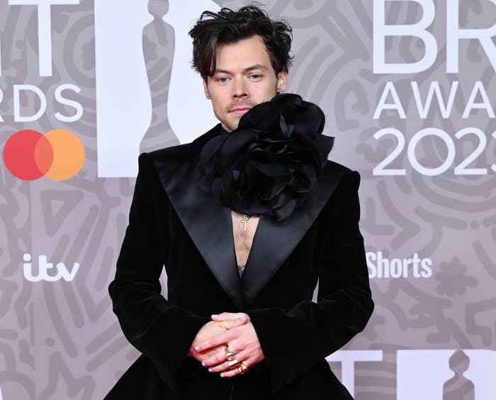 Harry in a suit with huge corsage