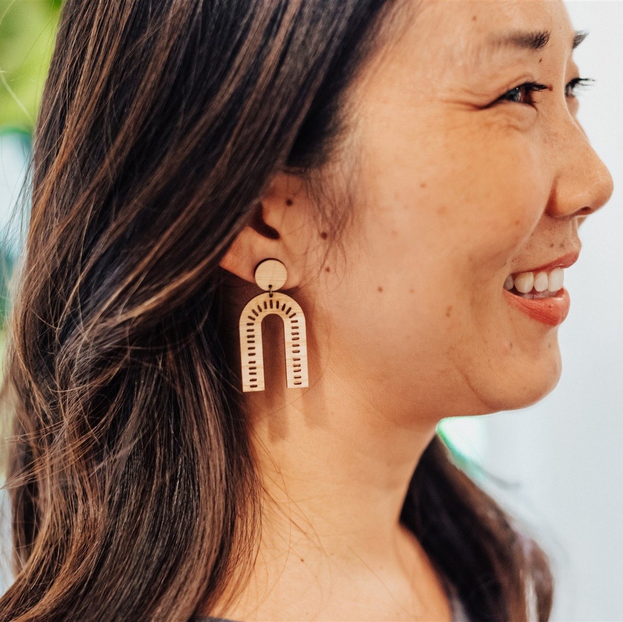 model wearing the arch statement earring