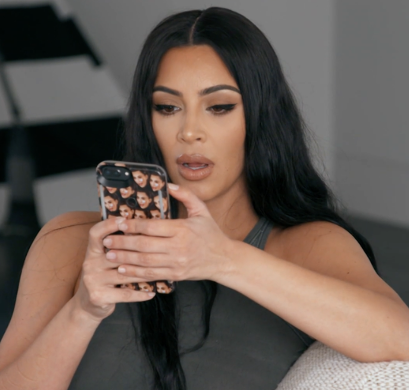 Kim Kardashian looking shocked at her phone