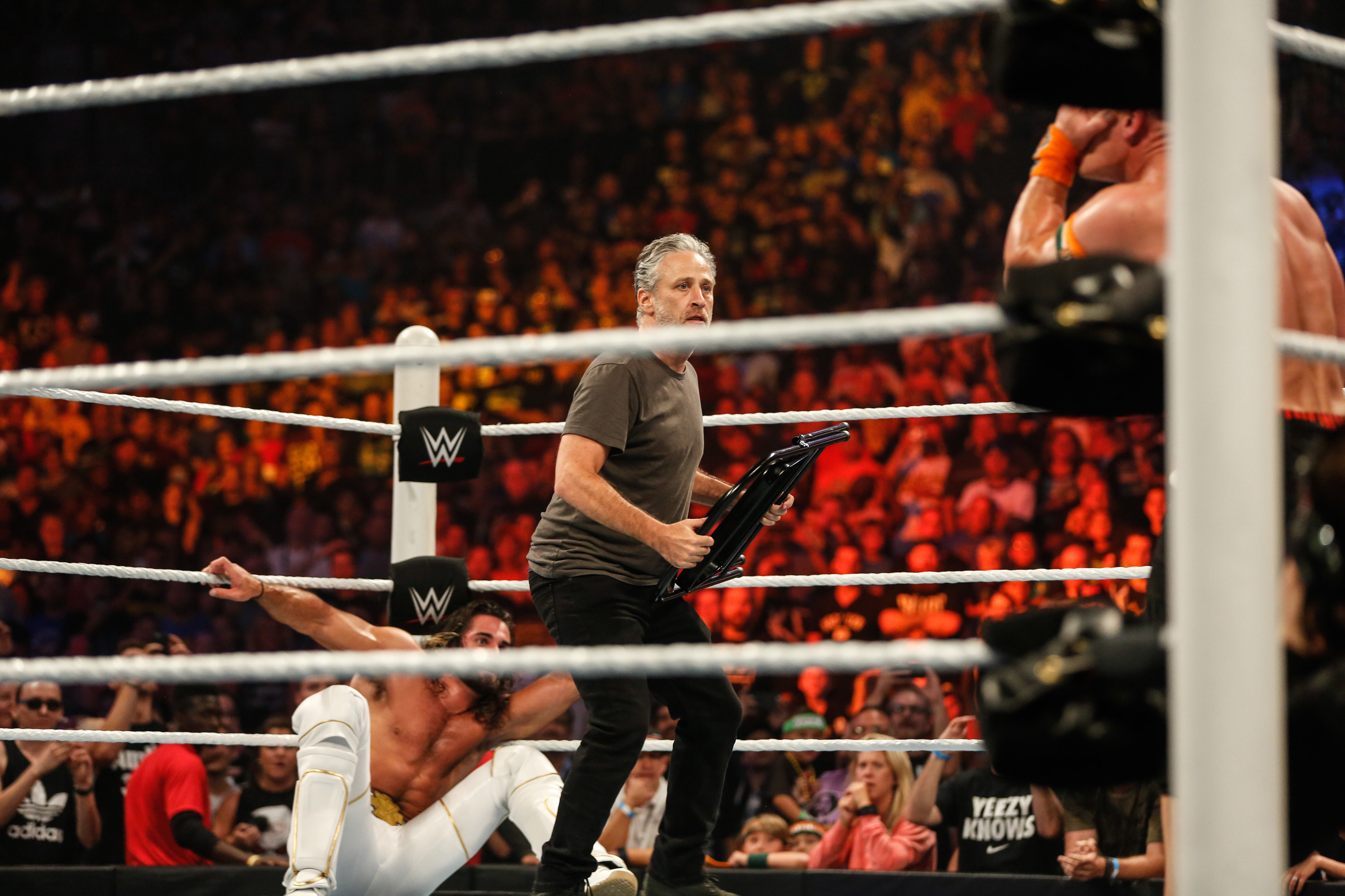 Jon Stewart gets into the action at WWE SummerSlam at the Barclays Center of Brooklyn on August 23, 2015 in New York City