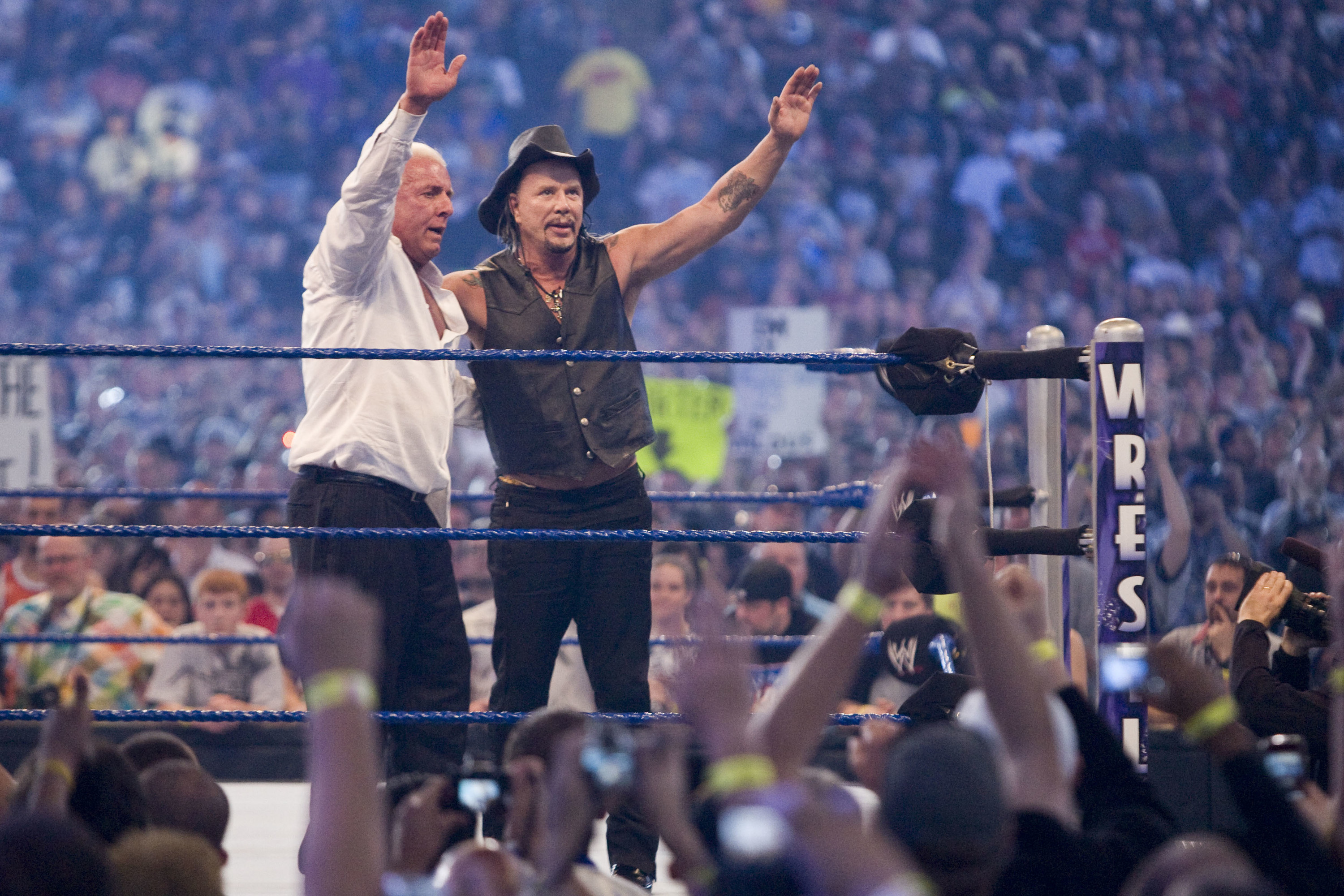 Actor Mickey Rourke celebrates with Ric Flair after beating WWE Superstar Chris Jericho during WrestleMania 25 at Reliant Stadium on April 5, 2009 in Houston, Texas