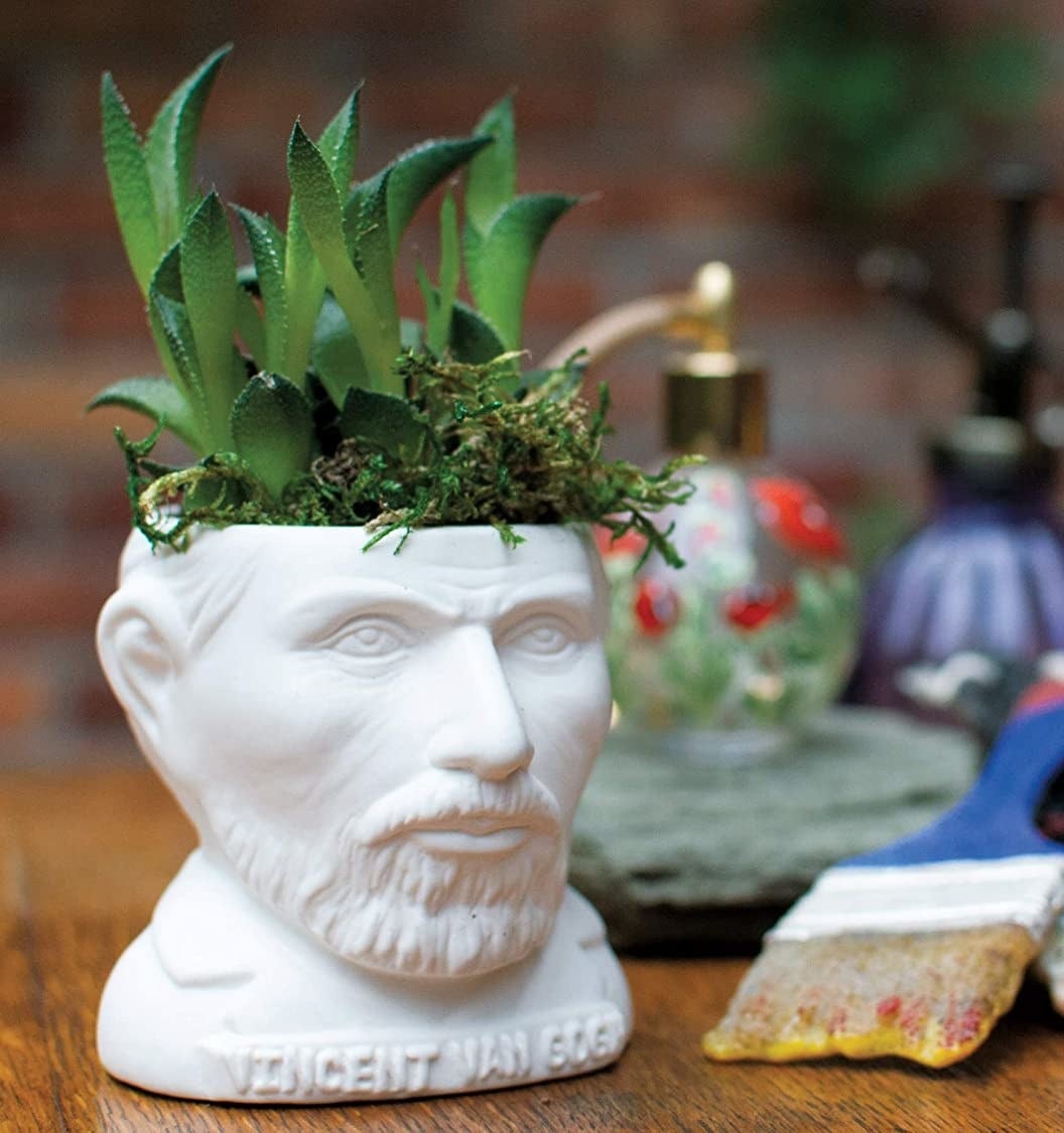 The Van Gogh planter surrounded by art supplies