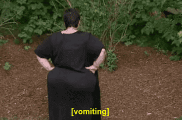 A GIF of a woman vomiting