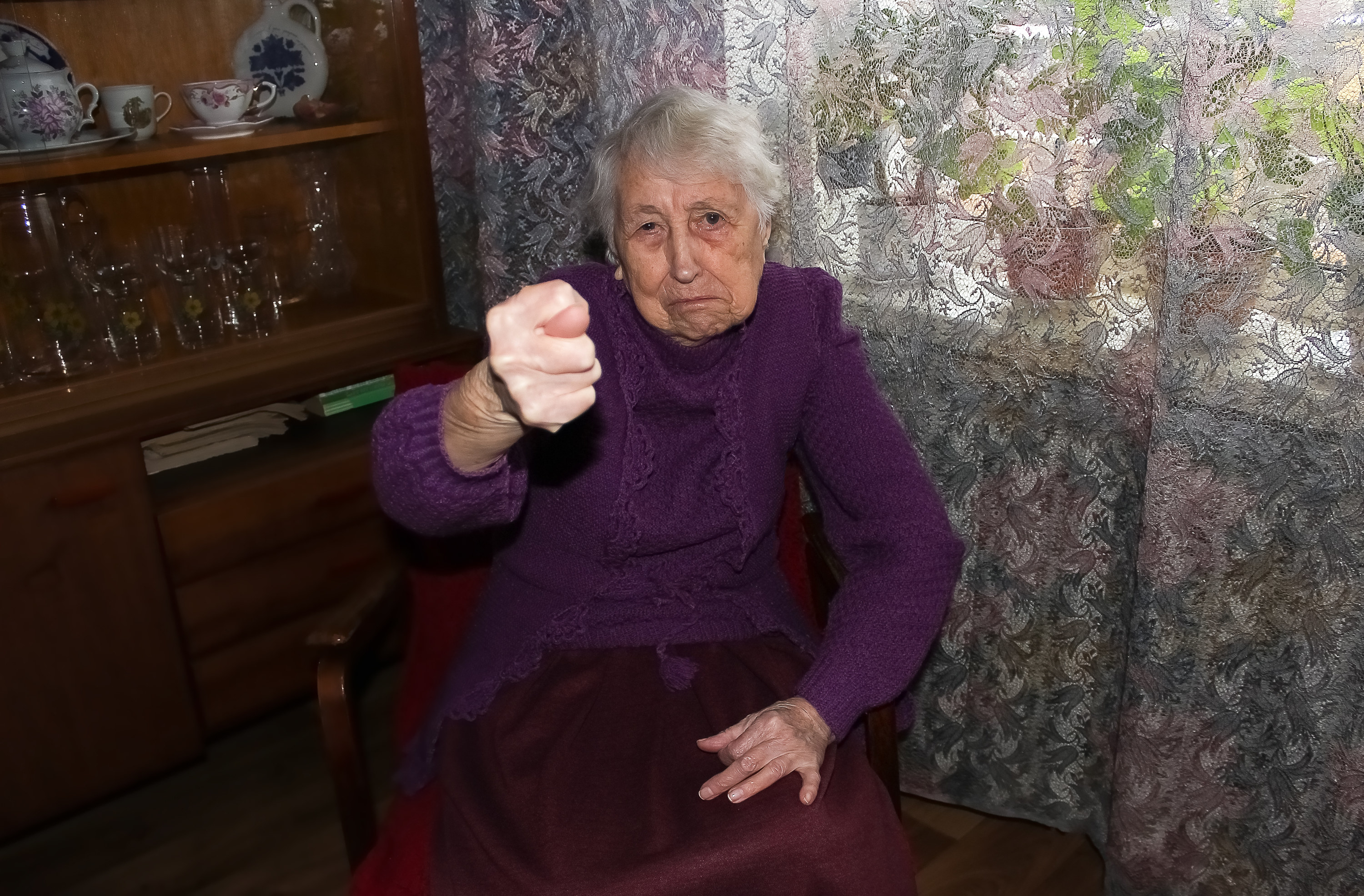A woman holding a fist in anger