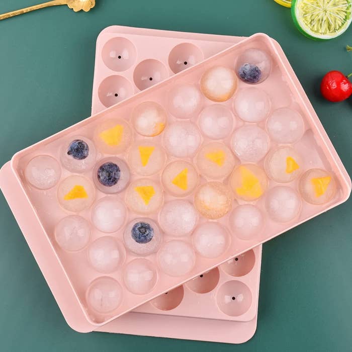 The filled tray stacked on top of its lid