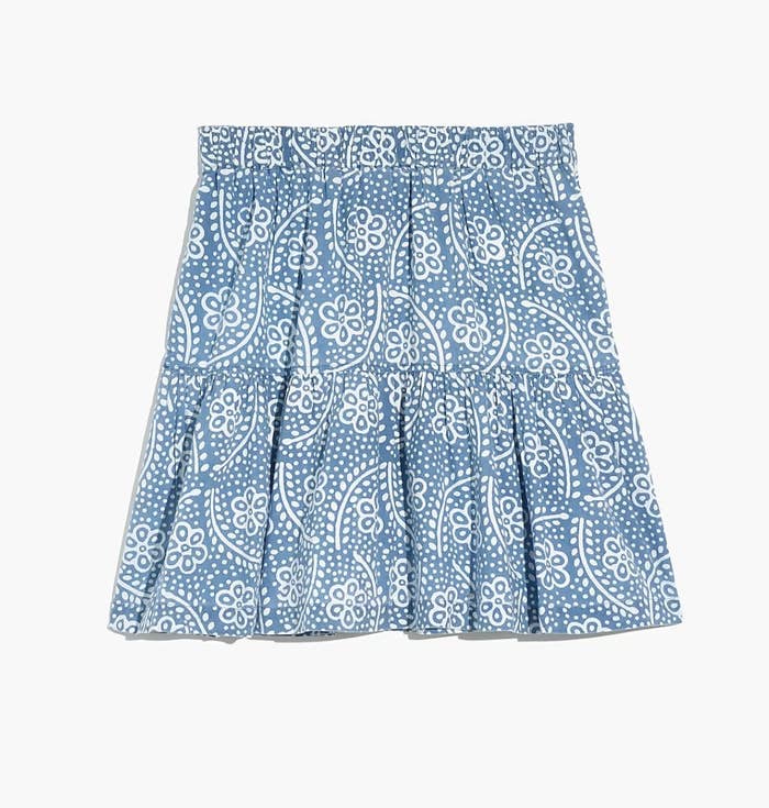 the blue skirt with a white floral print