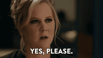 amy Schumer with her eyes wide open with text that says yes, please