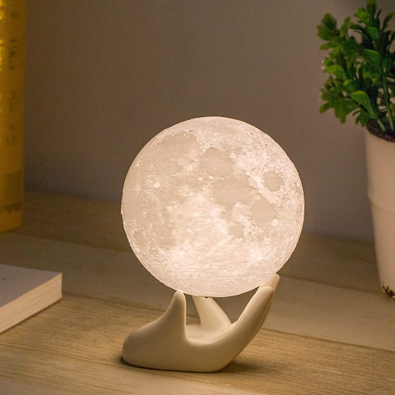 the moon lamp on a hand stand