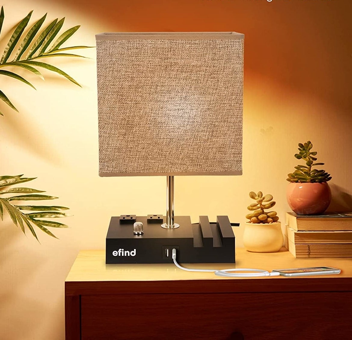 the table lamp on, on a nightstand