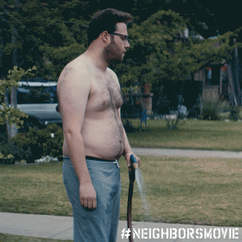 Seth Rogen watering the lawn shirtless